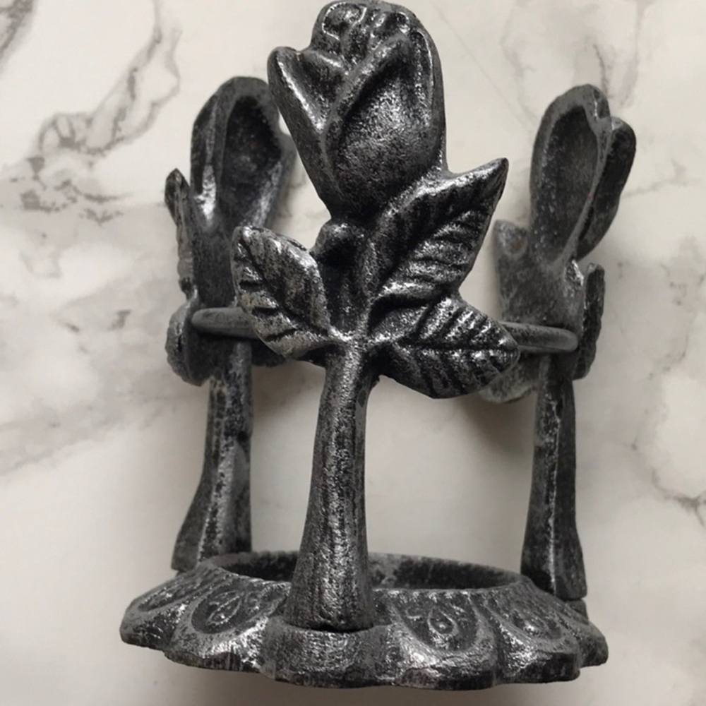 Steel metal rose base with clear glass wax melt holder .